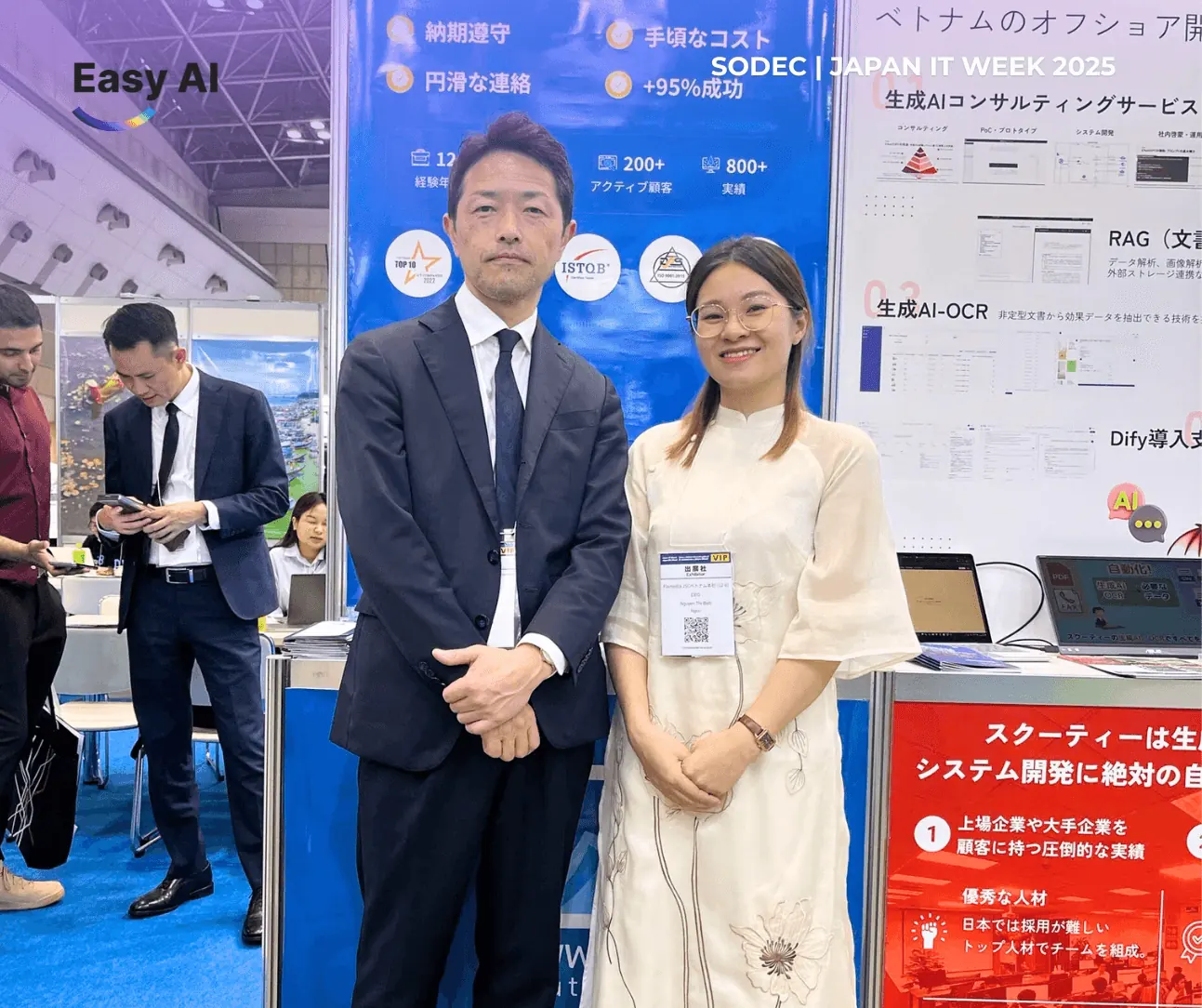 Tram Nguyen with an attendee at the Easy AI booth